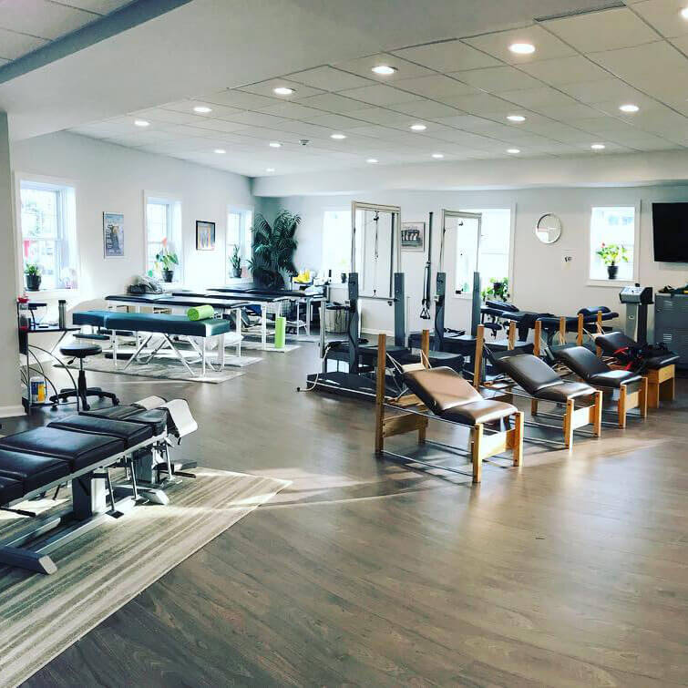 Spacious and well-equipped interior of 'The Chiropractic Source' clinic for spinal care.